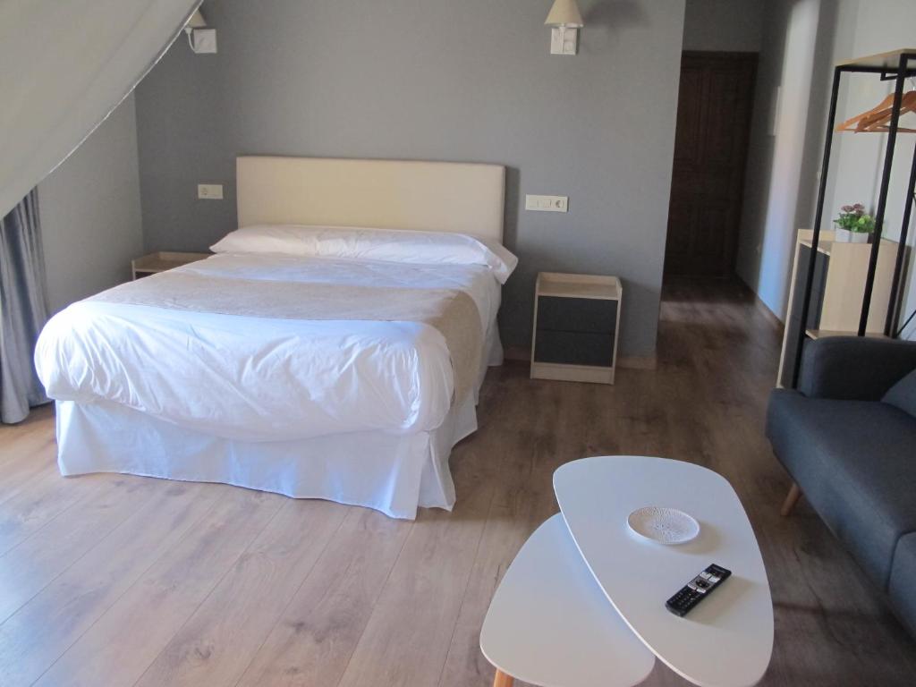 Postel nebo postele na pokoji v ubytování Apartamentos Turísticos La Casa Grande