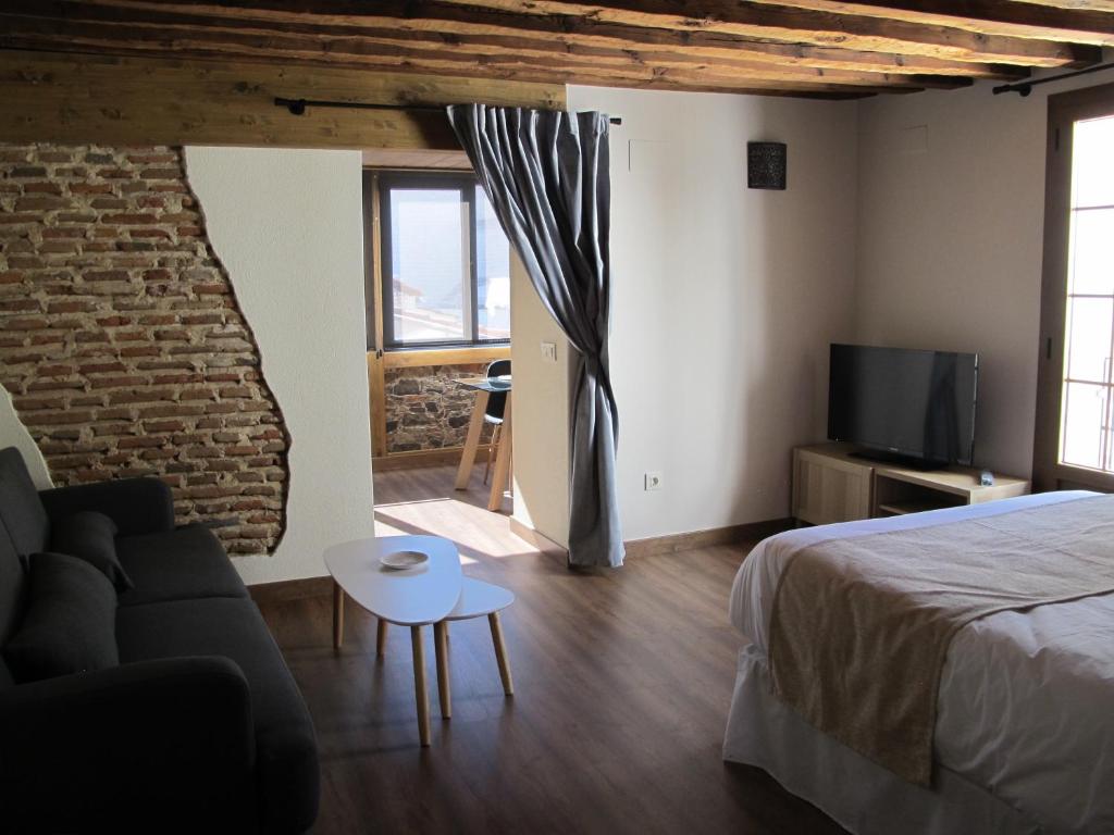 Postel nebo postele na pokoji v ubytování Apartamentos Turísticos La Casa Grande