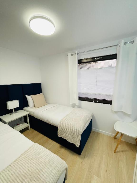 Posteľ alebo postele v izbe v ubytovaní Beds Friends Apartments