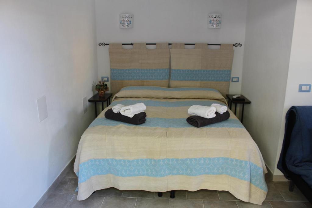 Posteľ alebo postele v izbe v ubytovaní B&B Sa Pedra Longa