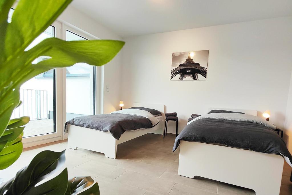 Postel nebo postele na pokoji v ubytování Modern Apartment near Offenbach in Seligenstadt