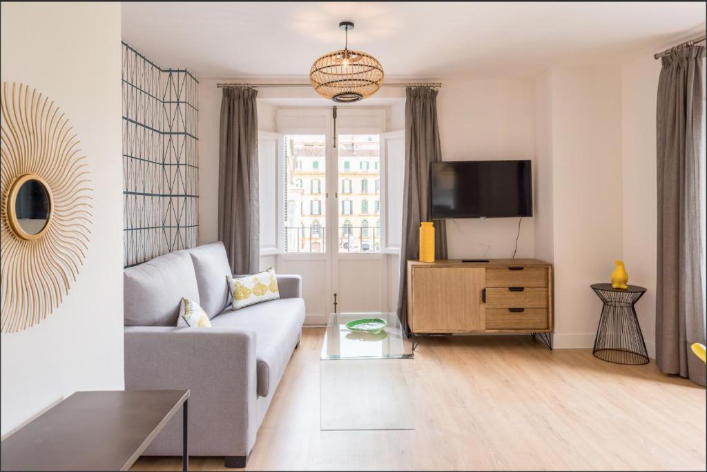 TV a/nebo společenská místnost v ubytování Duplex Merced10 3J