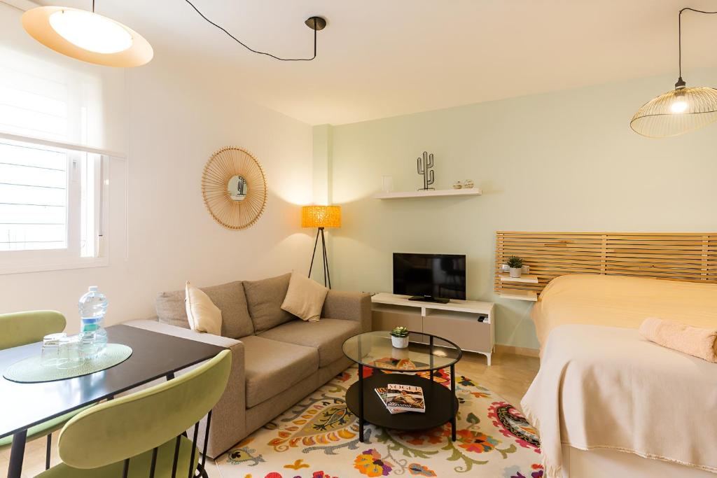 Televízia a/alebo spoločenská miestnosť v ubytovaní Teatro Suites Málaga CITY FLAT