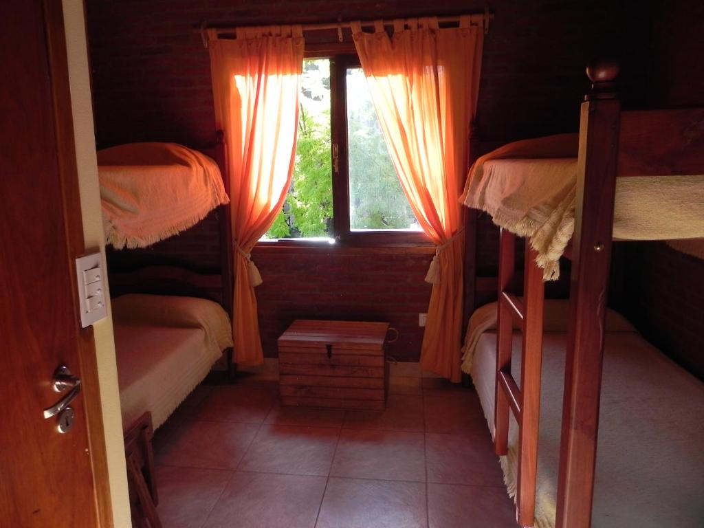 a bedroom with two bunk beds and a window at Acacias Blancas in Costa del Este