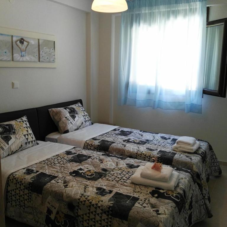 A bed or beds in a room at Ariadni -Villas- luxury houses
