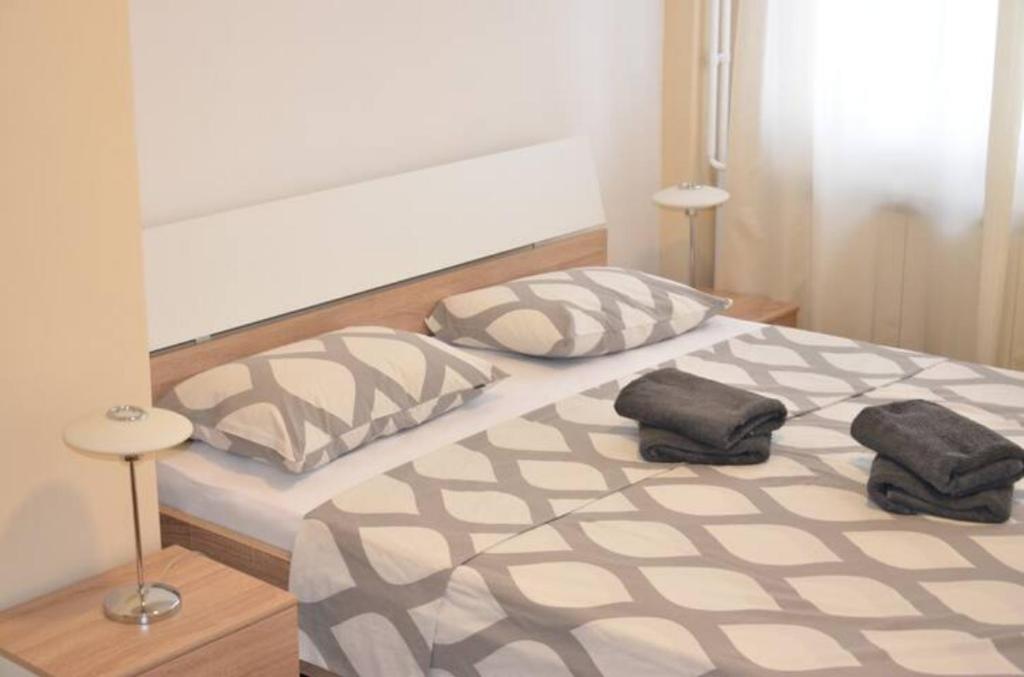 Krevet ili kreveti u jedinici u okviru objekta Apartments Sat