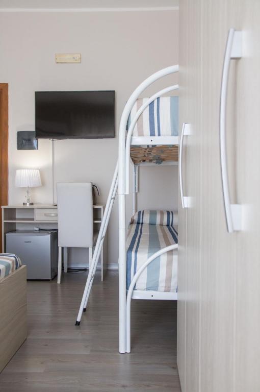 Postel nebo postele na pokoji v ubytování BluRiva Hotel