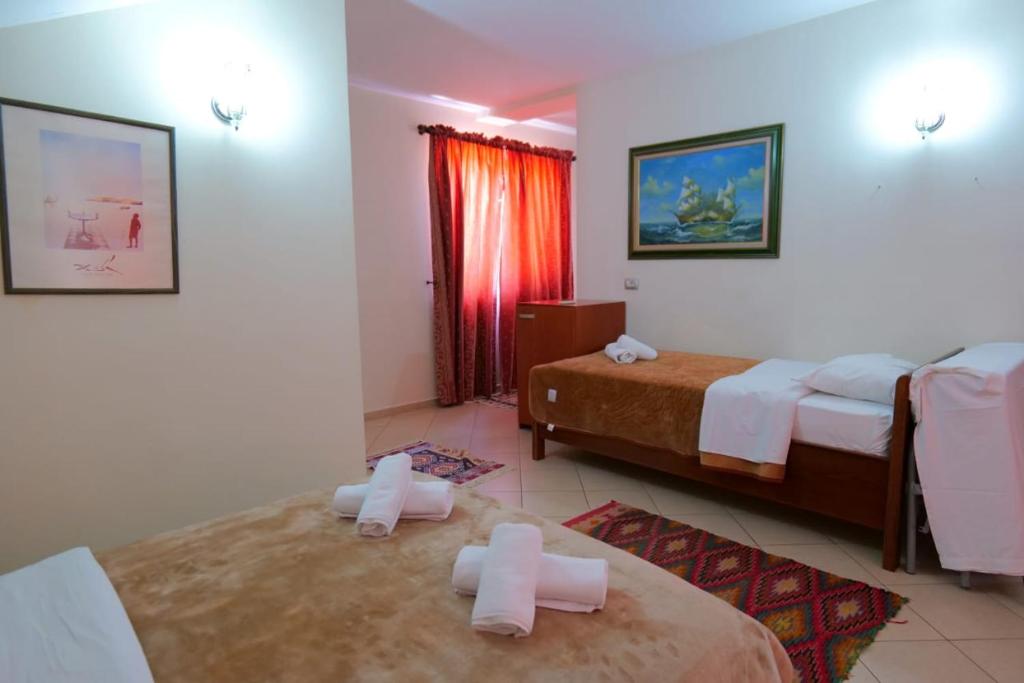 Postel nebo postele na pokoji v ubytování Hotel Veli