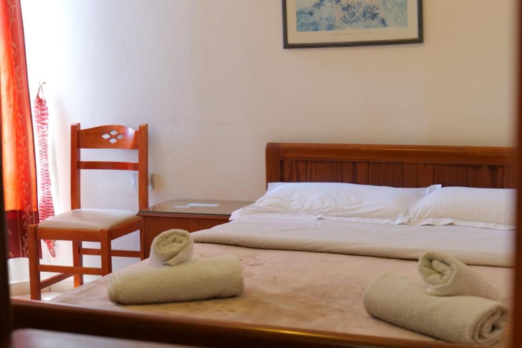 Postel nebo postele na pokoji v ubytování Hotel Veli