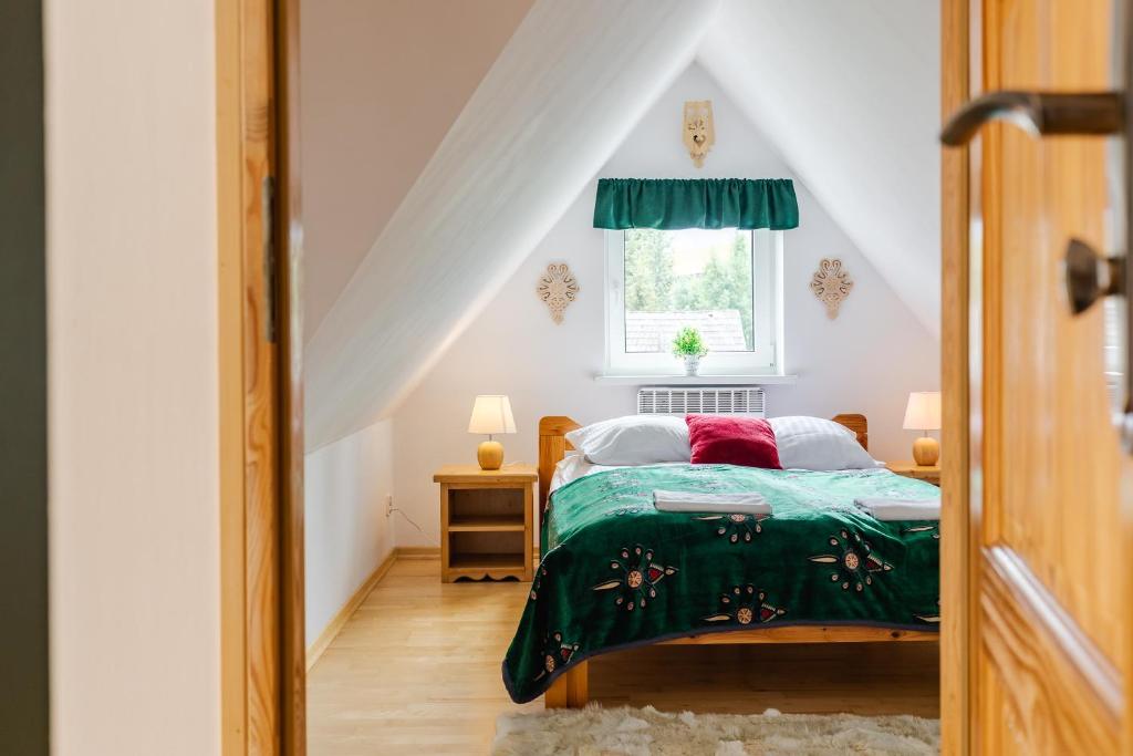 Posteľ alebo postele v izbe v ubytovaní Apartamenty Butorowy Zakopane
