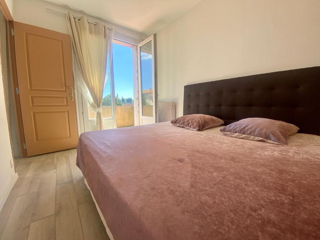 Posteľ alebo postele v izbe v ubytovaní Les terrasses d'iéna - 2 chambres avec parking privé