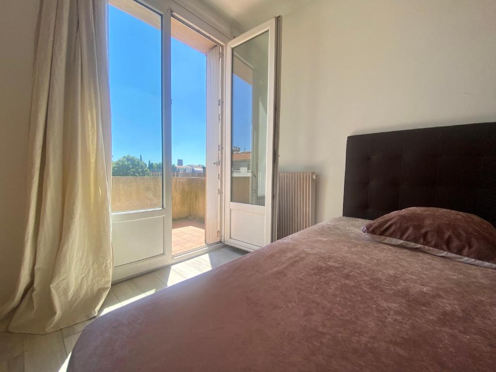Posteľ alebo postele v izbe v ubytovaní Les terrasses d'iéna - 2 chambres avec parking privé