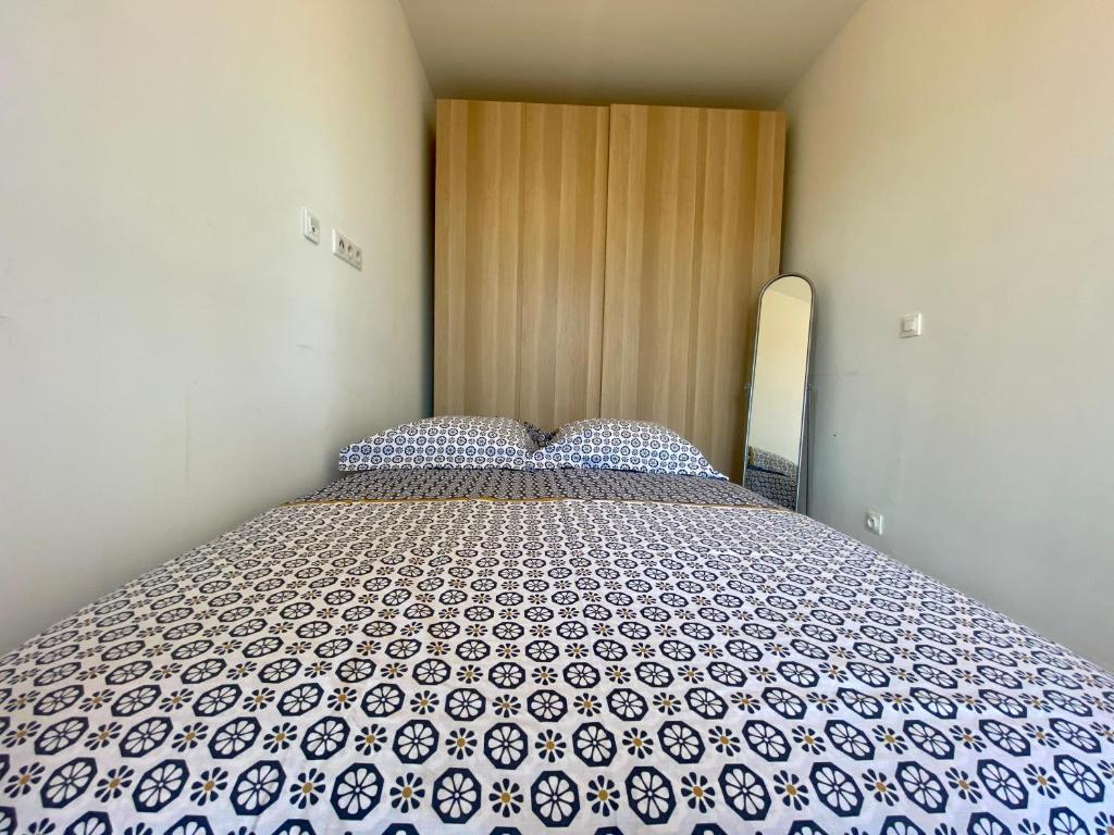 Posteľ alebo postele v izbe v ubytovaní Les terrasses d'iéna - 2 chambres avec parking privé