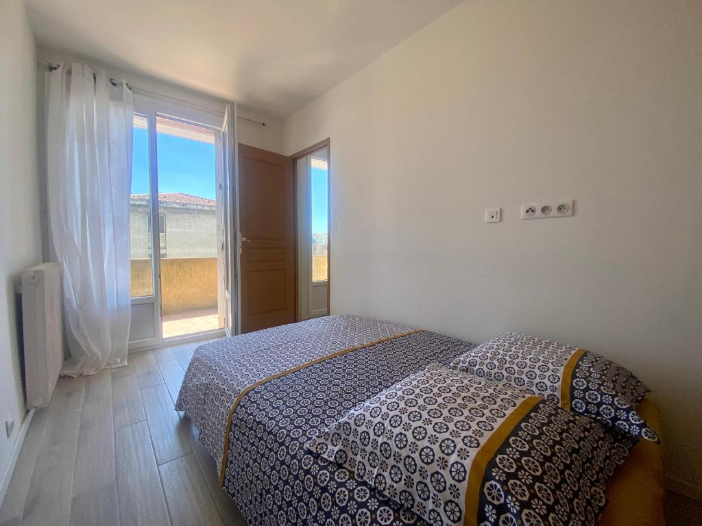 Posteľ alebo postele v izbe v ubytovaní Les terrasses d'iéna - 2 chambres avec parking privé