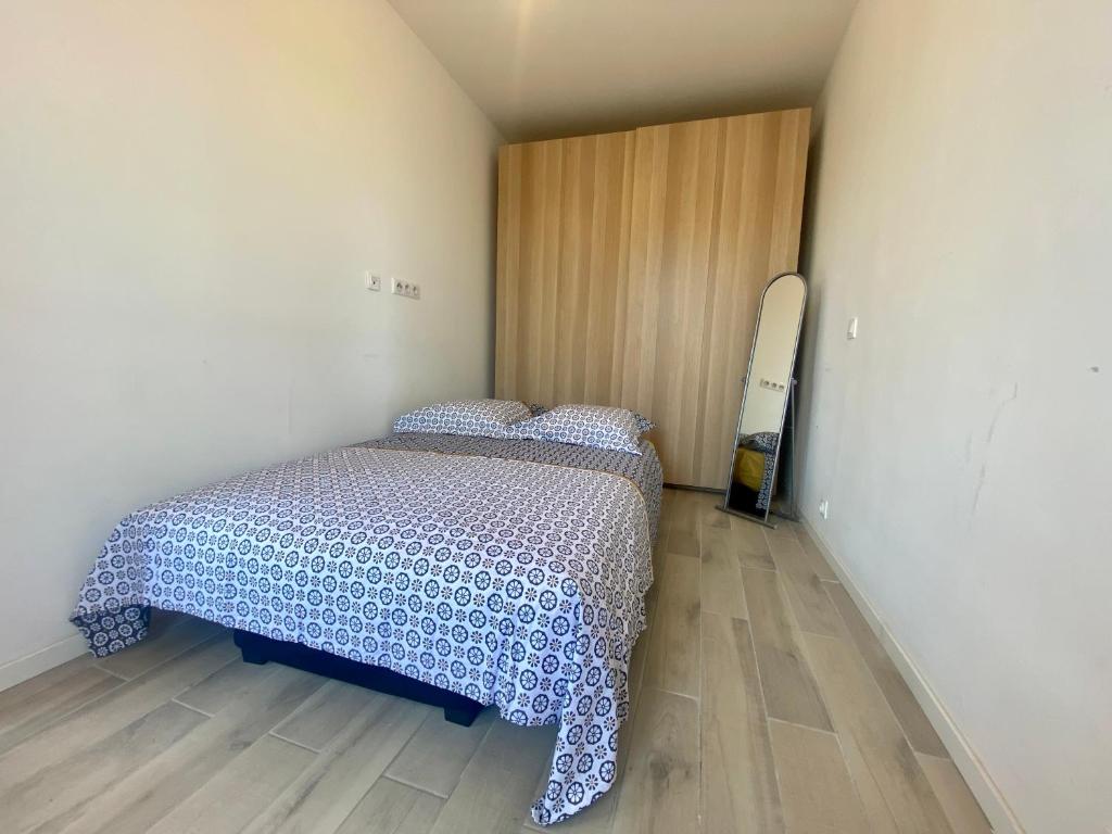 Posteľ alebo postele v izbe v ubytovaní Les terrasses d'iéna - 2 chambres avec parking privé