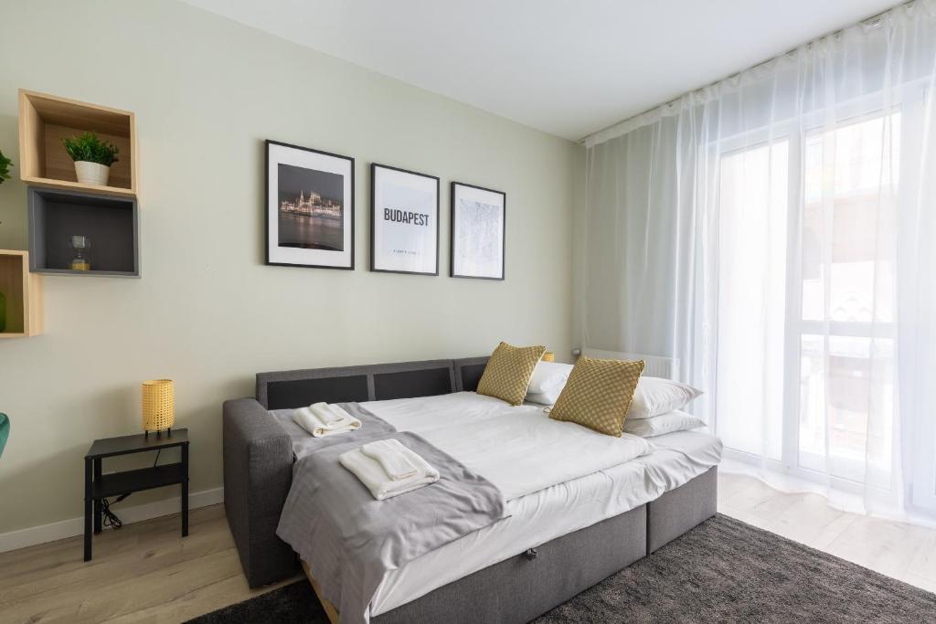 Posteľ alebo postele v izbe v ubytovaní Second Home Apartment