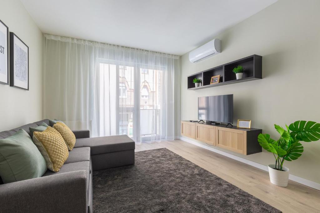 Televízia a/alebo spoločenská miestnosť v ubytovaní Second Home Apartment
