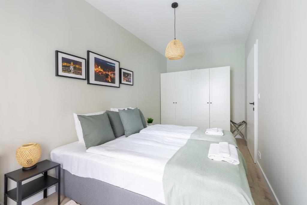 Posteľ alebo postele v izbe v ubytovaní Second Home Apartment