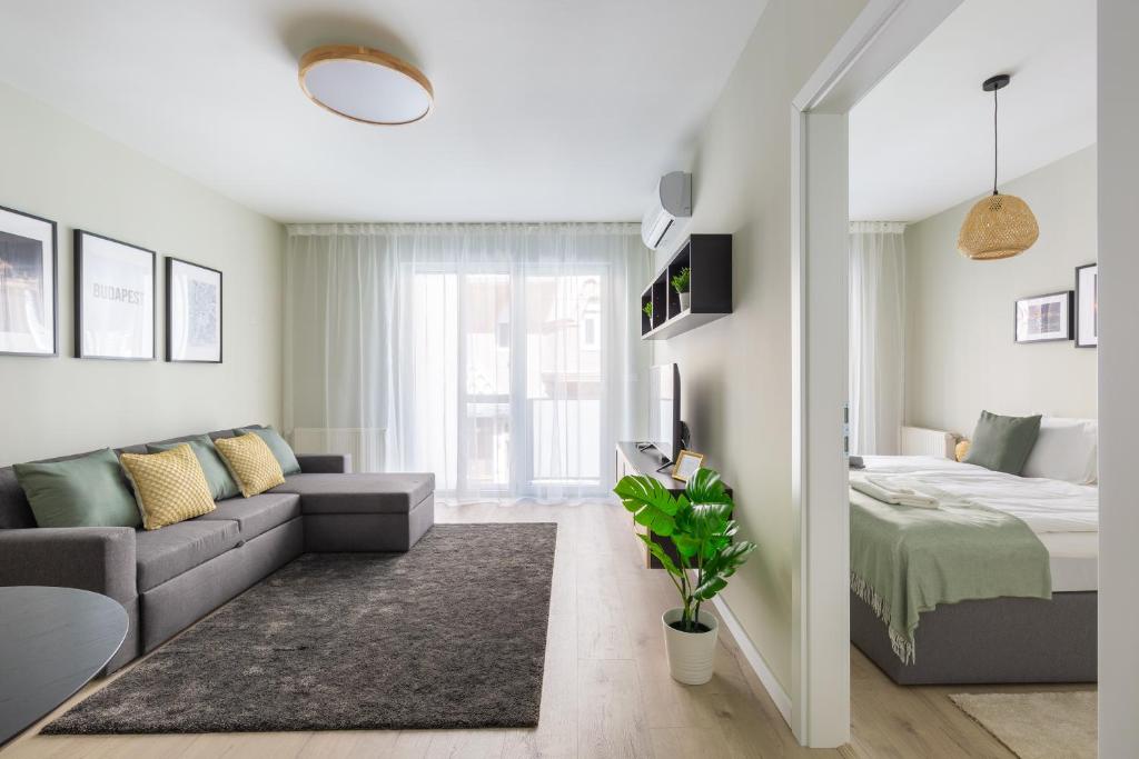 Posteľ alebo postele v izbe v ubytovaní Second Home Apartment