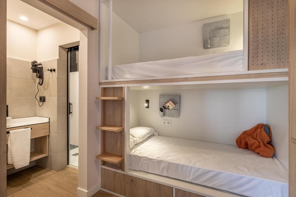 A bed or beds in a room at Líbere Córdoba Patio Santa Marta