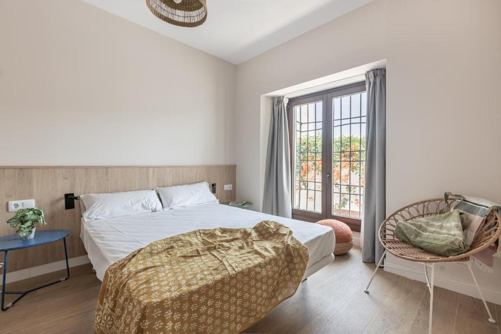 A bed or beds in a room at Líbere Córdoba Patio Santa Marta