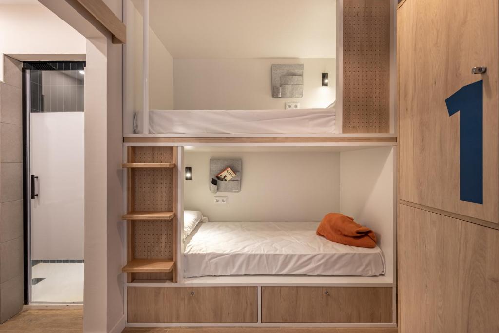 A bed or beds in a room at Líbere Córdoba Patio Santa Marta