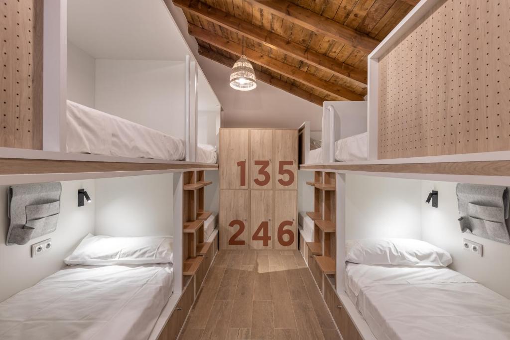 A bed or beds in a room at Líbere Córdoba Patio Santa Marta