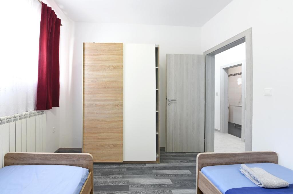 Posteľ alebo postele v izbe v ubytovaní Apartments MiraSol