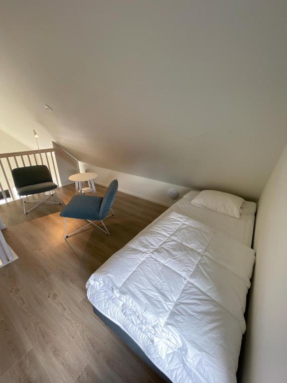 Postel nebo postele na pokoji v ubytování Rocklunda Village