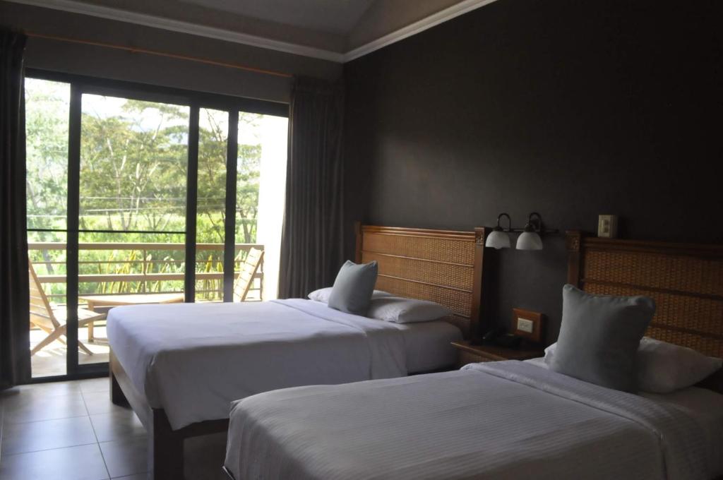 Uma cama ou camas num quarto em Hotel Ladera