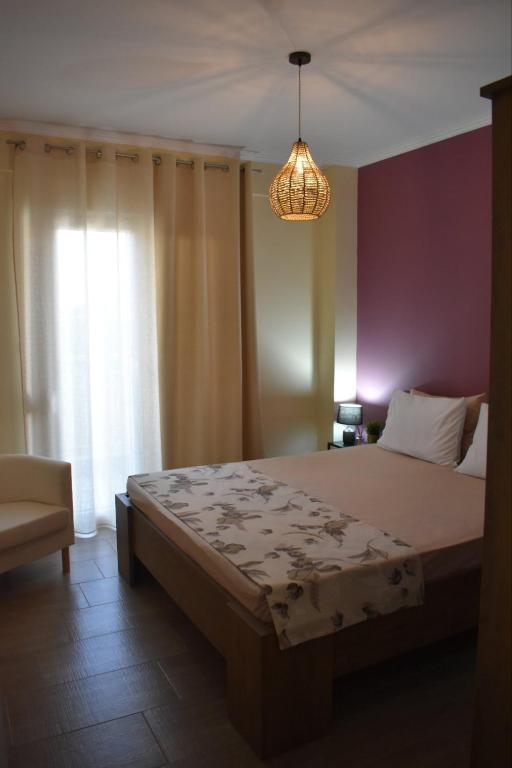 Postel nebo postele na pokoji v ubytování Emily Apartment -N.Kallikratia