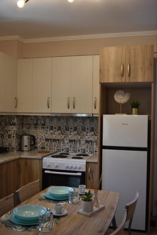 Kuchyň nebo kuchyňský kout v ubytování Emily Apartment -N.Kallikratia
