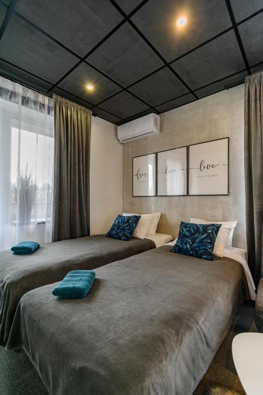 Postel nebo postele na pokoji v ubytování Apartments24 Ilu