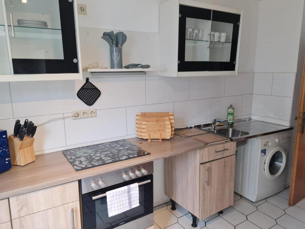 a kitchen with a sink and a dishwasher at Promotion Prices Monteurwohnung nahe Pforzheim und Karlsruhe in Birkenfeld