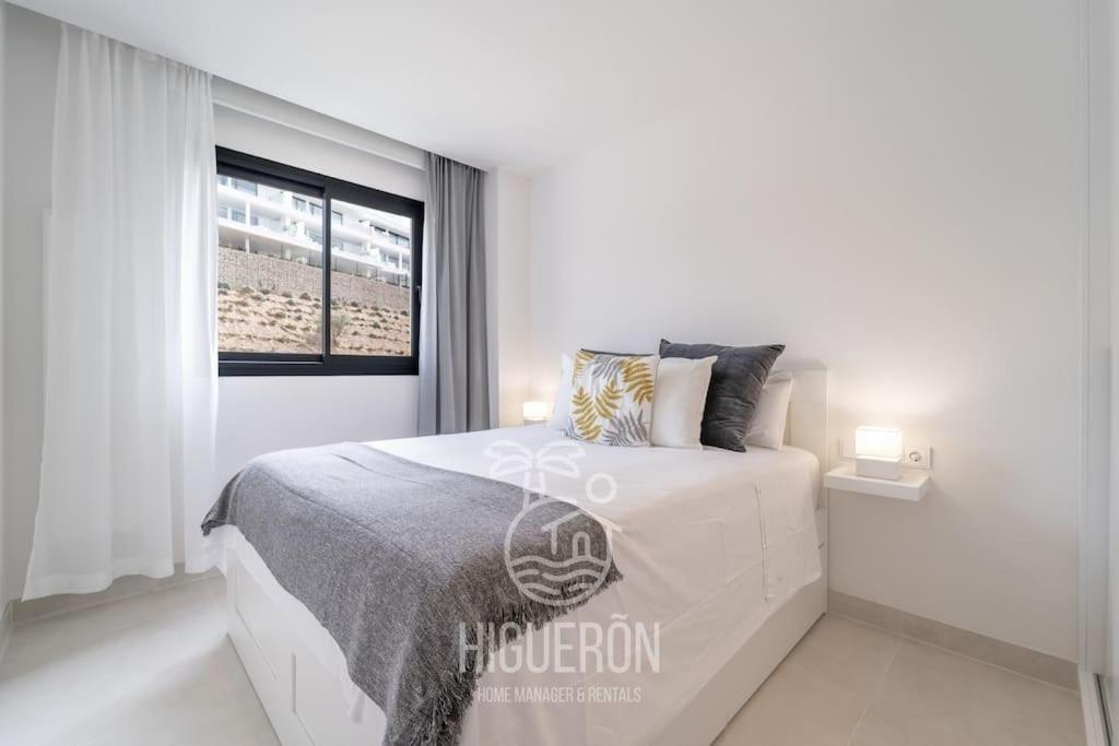 A bed or beds in a room at HigueronRentals El Dado