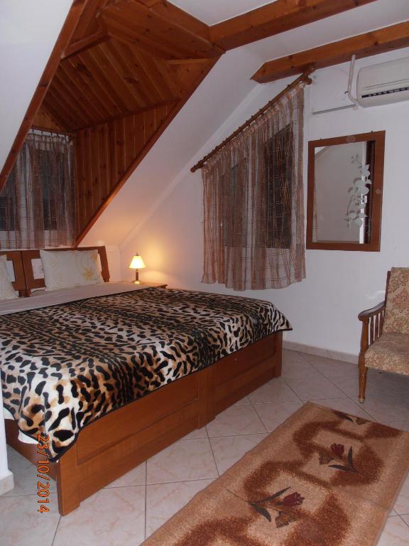 A bed or beds in a room at Guesthouse Agnandi