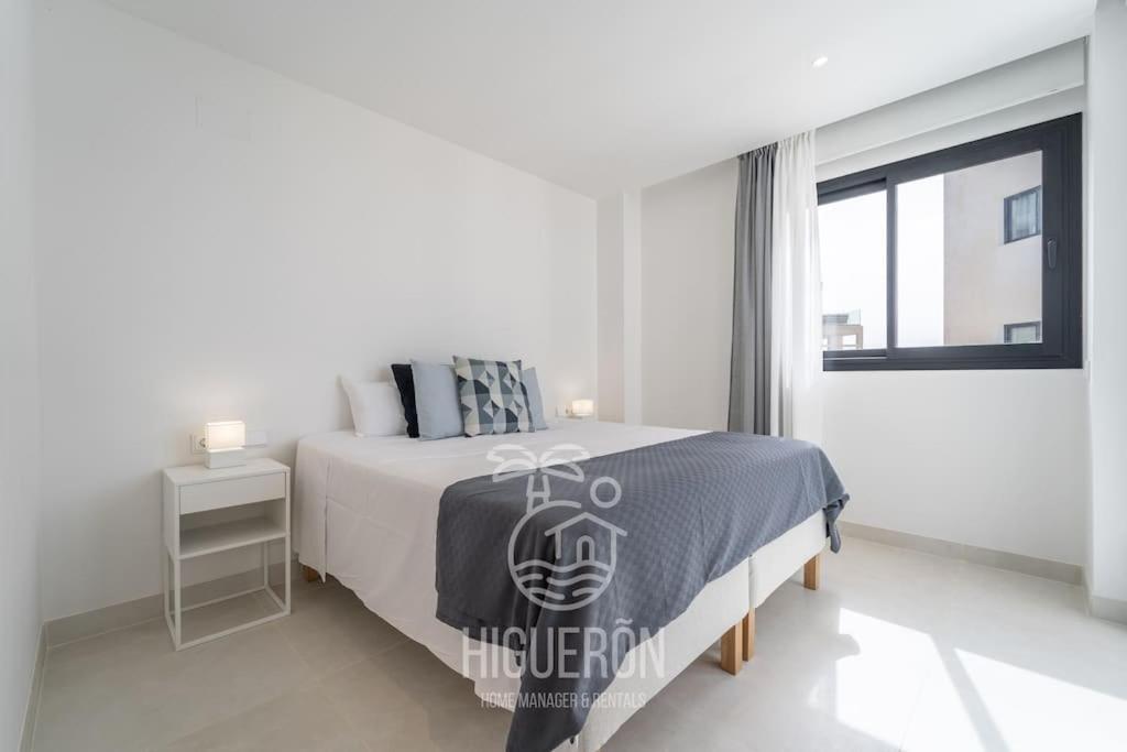 A bed or beds in a room at HigueronRentals El Dado