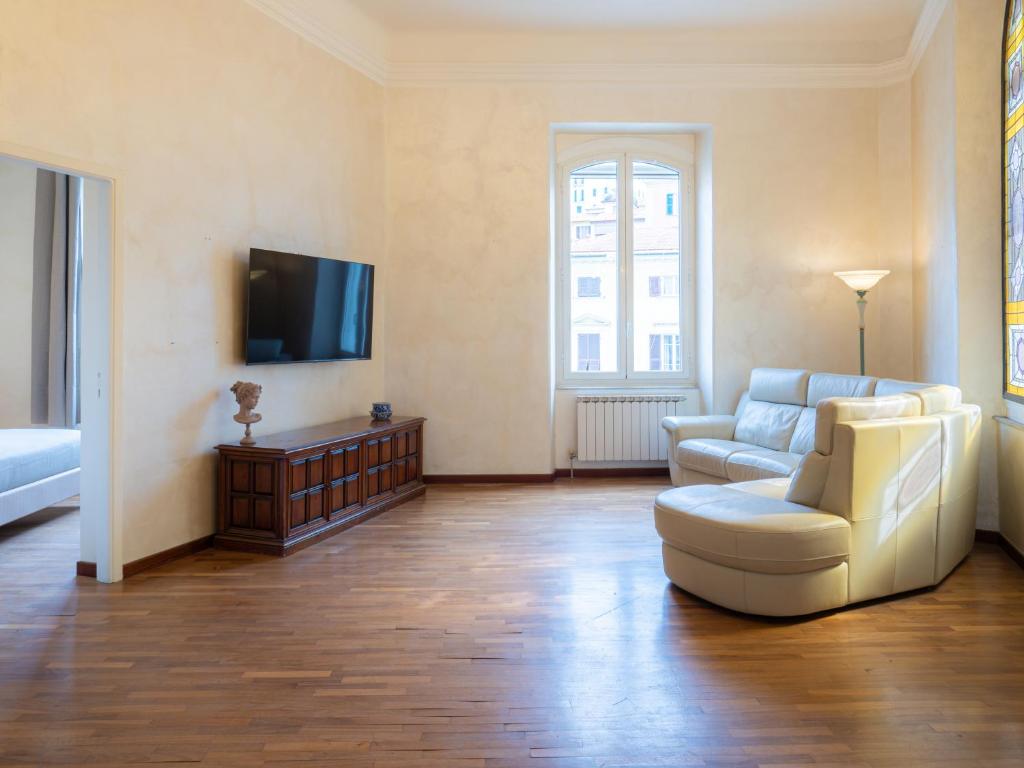 TV a/nebo společenská místnost v ubytování L'Opera Rooms & Suite
