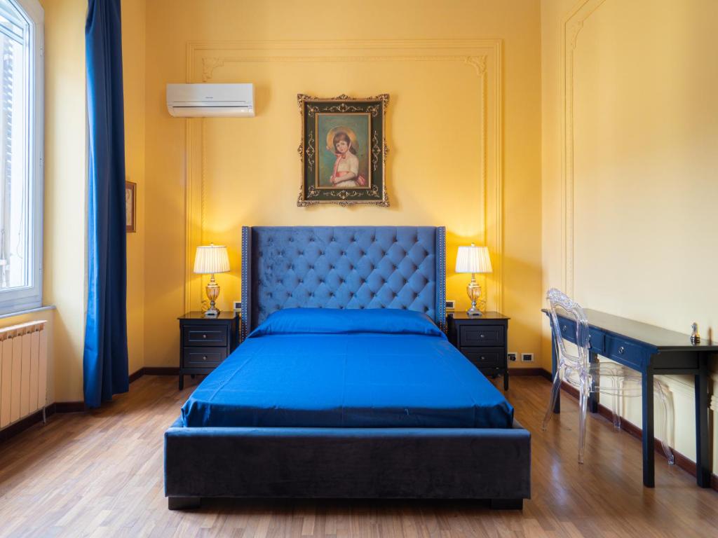 Postel nebo postele na pokoji v ubytování L'Opera Rooms & Suite