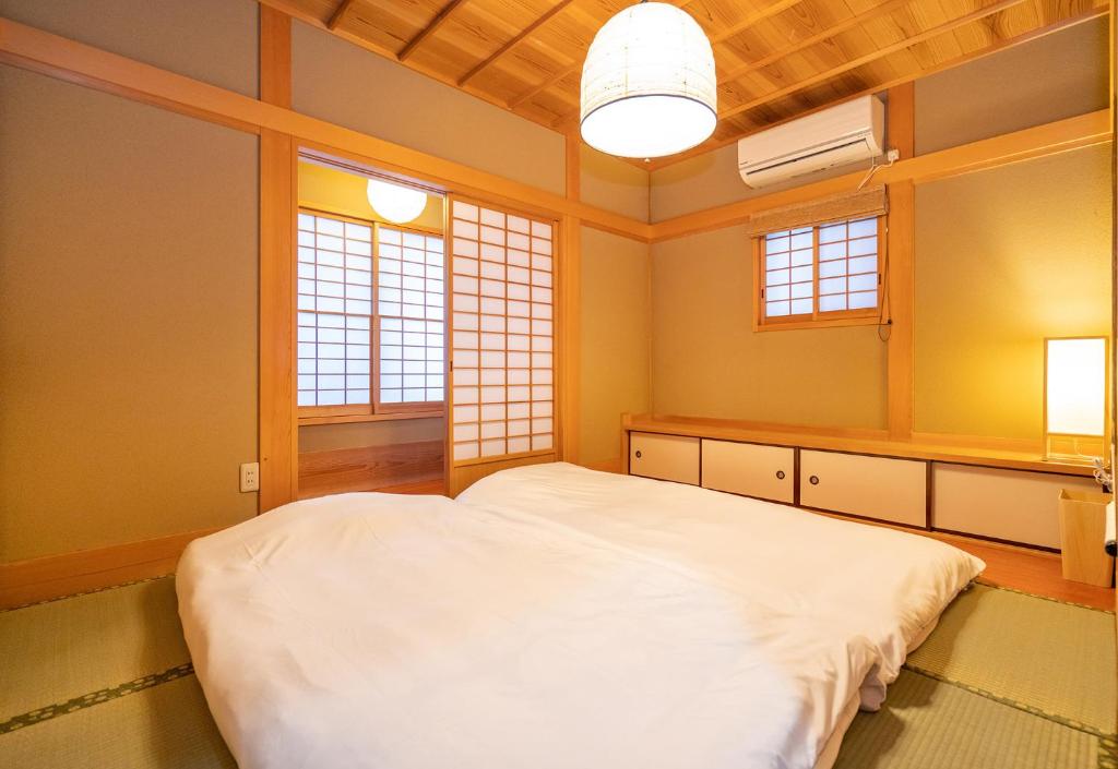 Postel nebo postele na pokoji v ubytování Japanese traditional house.Ryokan in asakusa with 2bedrooms