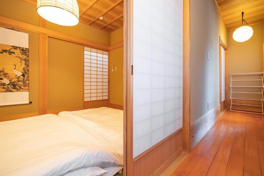 Postel nebo postele na pokoji v ubytování Japanese traditional house.Ryokan in asakusa with 2bedrooms