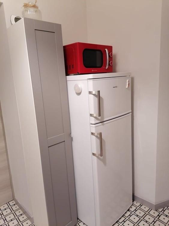 Kuchyň nebo kuchyňský kout v ubytování AUXIMUM Appartamenti