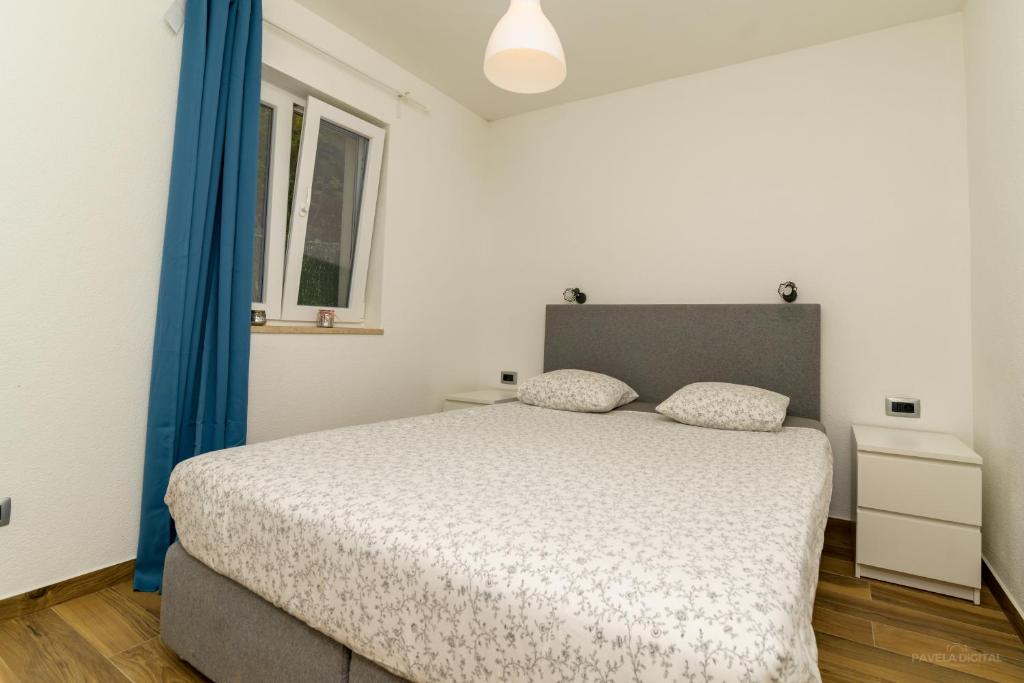 Postel nebo postele na pokoji v ubytování STONE HOUSE MAGALI