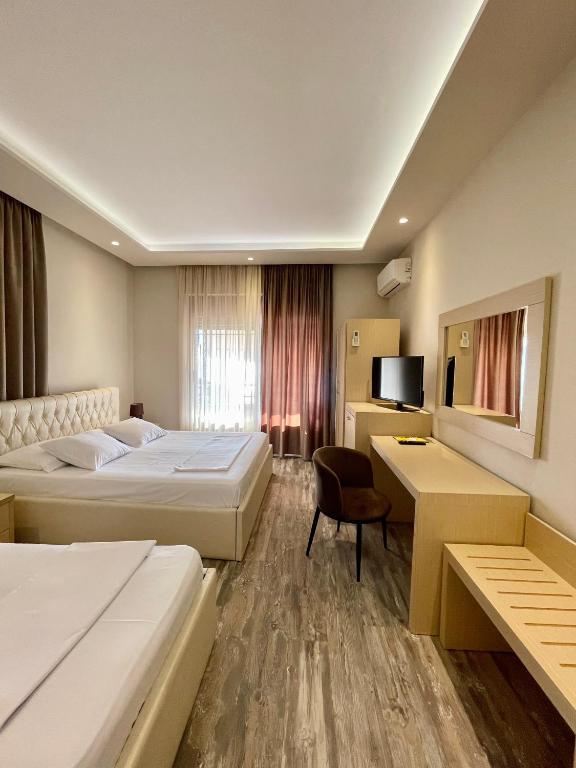Postel nebo postele na pokoji v ubytování Hotel Lungomare