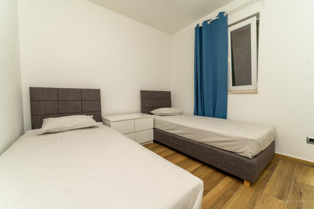 Postel nebo postele na pokoji v ubytování STONE HOUSE MAGALI