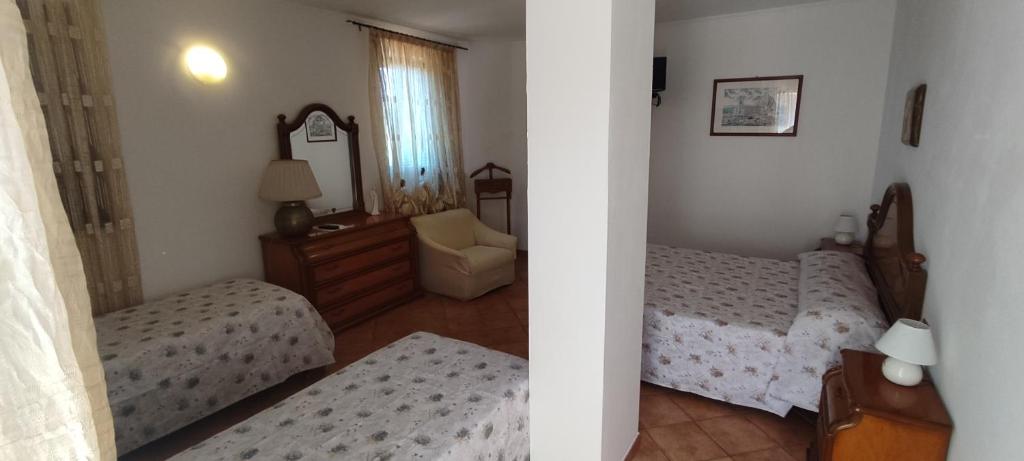 Postel nebo postele na pokoji v ubytování Bed & Breakfast Laino