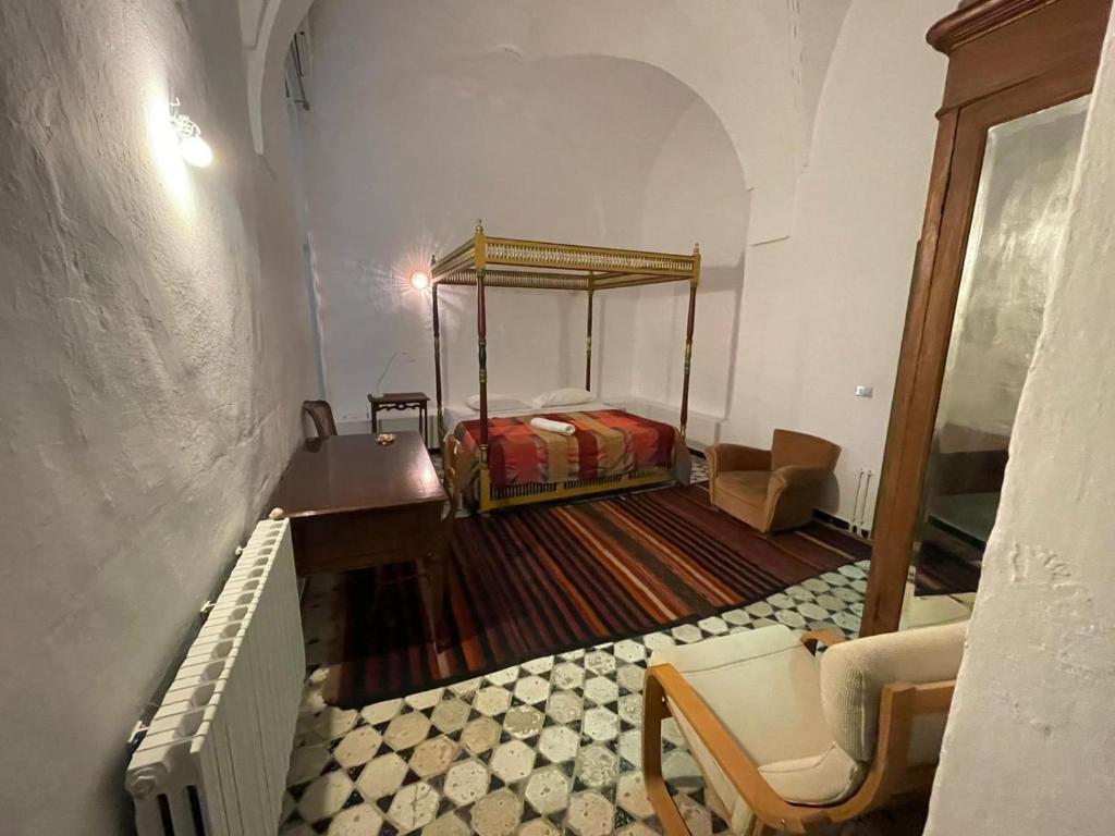 Postel nebo postele na pokoji v ubytování Dar Hayder-la Medina