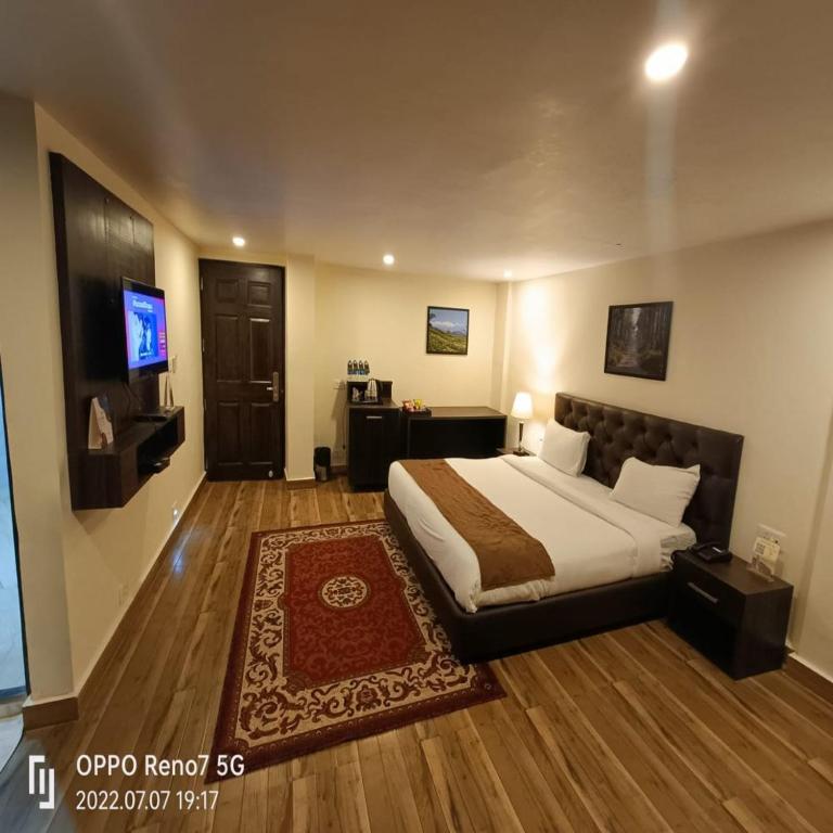 Postel nebo postele na pokoji v ubytování Istana Resort & Spa