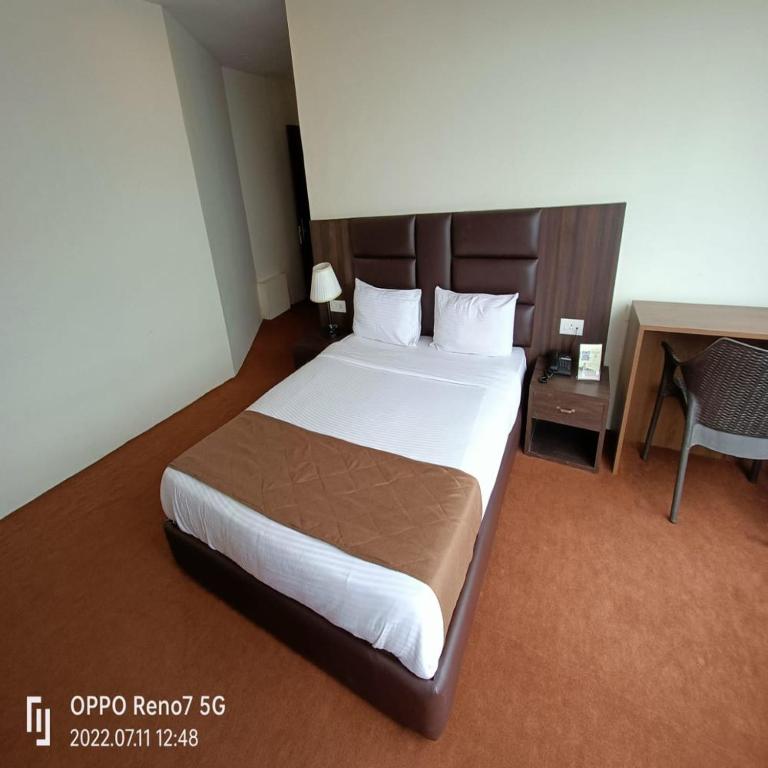 Postel nebo postele na pokoji v ubytování Istana Resort & Spa