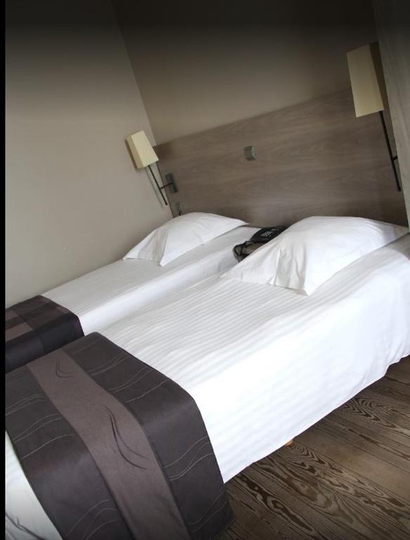 Postel nebo postele na pokoji v ubytování Arriate Hotel